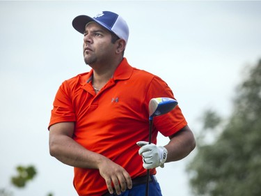 Alykhan Essa follows the flight of his drive during men's Division play at The Marshes on Saturday.   Ashley Fraser/Postmedia