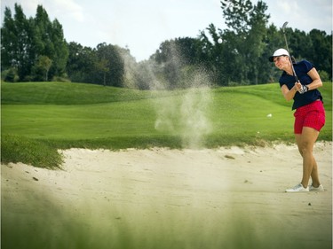 Celina Stipanic hits a bunker shot during Saturday's round at The Marshes.   Ashley Fraser/Postmedia