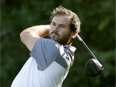 Andy Rajhathy follows the flight of his tee shot during final-round play in the Ottawa Sun Scramble at Eagle Creek on Sunday. Patrick Doyle/Postmedia