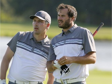 Mitch Dale and Andy Rajhathy consult during the final round of the Ottawa Sun Scramble at Eagle Creek on Sunday. Patrick Doyle/Postmedia