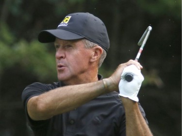 Graham Gunn follows the flight of his ball after hitting a shot during Sunday's final round of the Ottawa Sun Scramble at Eagle Creek. Patrick Doyle/Postmedia