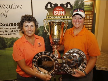 Brenda Pilon, left, and Lise Jubinville display the trophies after finishing first in the Yakabuski Ladies Open Division of the Ottawa Sun Scramble at Eagle Creek on Sunday. Patrick Doyle/Postmedia
