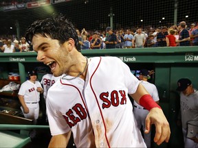Andrew Benintendi of the Boston Red Sox reacts after he is doused in Gatorade after hitting the game-winning walk-off single to defeat the New York Yankees in the tenth inning at Fenway Park on August 6, 2018 in Boston, Massachusetts. (Adam Glanzman/Getty Images)