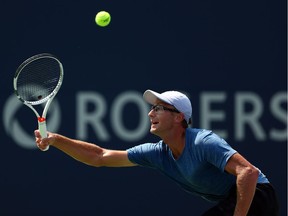 Peter Polansky of Thornhiil, Ont., plays a shot against Matthew Ebden of Australia during a first-round singles match on Monday.