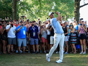 Brooks Koepka plays a recovery shot from off the side of the 15th hole during the third round of the PGA Championship on Saturday.