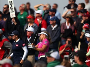 A massive crowd of spectators watches as Brooke Henderson hits her tee shot on the 18th hole during the third round of the CP Women's Open at the Wascana Country Club on Saturday.