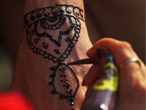 Henna art takes form during the Palestinian Festival at Marion Dewar Plaza on Friday. Jean Levac/Postmedia