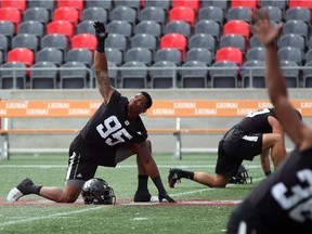 Danny Mason warms up at the start of Redblacks practice at TD Place stadium on Tuesday. Jean Levac/Postmedia