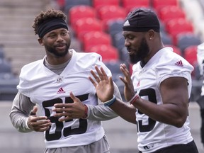 The Ottawa Redblacks' Diontae Spencer, left, and William Powell during practice at TD Place Stadium this week.