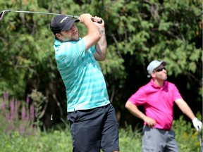 Chris Miner (who played with his brother Jason Miner, at right) was at the top of the leaderboard on day one of the Ottawa Sun Scramble at Mannerly on the Green golf course Monday.  The local golf tournament is played over the next week at different courses around the city.  Julie Oliver/Postmedia