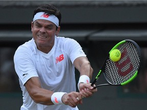 Milos Raonic is shown here during a Wimbledon quarterfinal match against JOhn Isner in July.