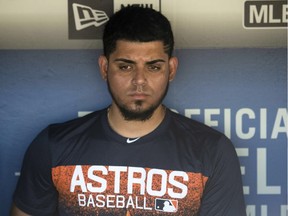 Houston Astros relief pitcher Roberto Osuna is interviewed in the dugout before Sunday's game against the Los Angeles Dodgers. The former Toronto Blue Jays player, recently acquired by the Astros, served a 75-game suspension for violating Major League Baseball's domestic violence policy.