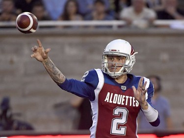 Alouettes quarterback Johnny Manziel (2) flips a pass to a receiver during second-quarter action against the Tiger-Cats on Friday in Montreal.