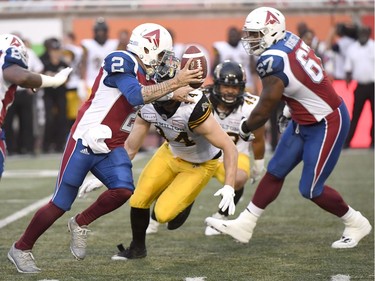 Montreal quarterback Johnny Manziel (2) scrambles under pressure from Hamilton defensive end Justin Capicciotti (94) during the first quarter of Friday's game.