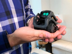 In this Monday, July 30, 2018, photo, Anki Inc. CEO Boris Sofman holds Vector, the company’s new home robot, in New York.