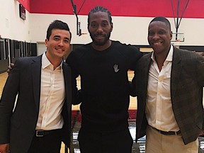 New Raptor Kawhi Leonard, centre, with team president Masai Ujiri in Toronto (Raptors/Twitter)