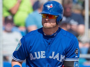 Toronto Blue Jays Josh Donaldson tosses his bat as he walks to first base second during third inning exhibition baseball action against the New York Yankees in Dunedin, Fla., Tuesday, Feb. 27, 2018.