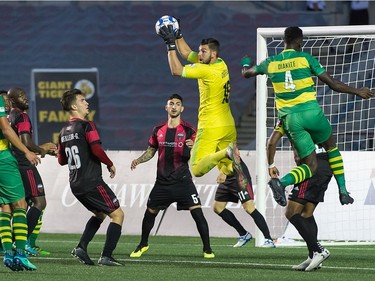 Fury FC goalkeeper Maxime Crépeau (in yellow) pulls in a high ball in front of the net during Friday's contest against the Rowdies. Steve Kingsman/Freestyle Photography for Ottawa Fury FC