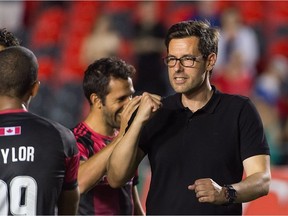Fury FC head coach Nikola Popovic, right, celebrates on the sidelines of a contest against the Rowdies.