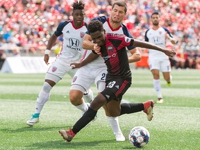 The Ottawa Fury's Kyle Fisher battles for possession of the ball against the Indy 11 at TD Place Stadium on Saturday, Aug. 18, 2018.