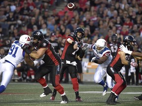 Redblacks quarterback Trevor Harris throws a pass during the first half of action against the Montreal Alouettes.