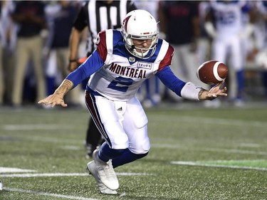 Alouettes quarterback Johnny Manziel scrambles for the football and recovers it before being sacked by a Redblacks defender.