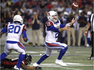 Alouettes quarterback Johnny Manziel (2) bobbles the football, but recovers it in the first half.