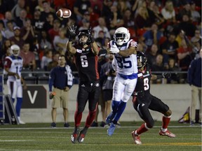 Ottawa Redblacks defensive back Antoine Pruneau (6) steps in front of Montreal Alouettes wide receiver B.J. Cunningham (85) to make an interception during first half CFL action in Ottawa on Friday, Aug. 31, 2018.
