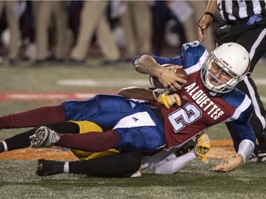 Alouettes quarterback Johnny Manziel (2) is sacked by Tiger-Cats defensive back Will Hill during the second quarter of Friday's game.