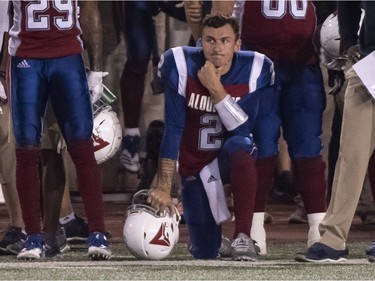 Quarterback Johnny Manziel watches from the sidelines in the fourth quarter, when backup QB Vernon Adams drove the Alouettes to their only touchdown of the game against the Tiger-Cats on Friday night.