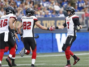 Redblacks quarterback Trevor Harris celebrates Greg Ellingson's two-point convert on a first-half touchdown against the Blue Bombers.