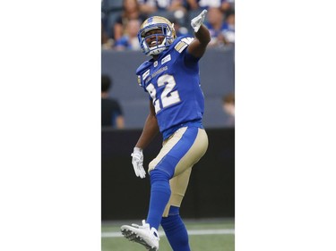 The Blue Bombers' Chandler Fenner (22) celebrates a tackle against the Redblacks during the first half.