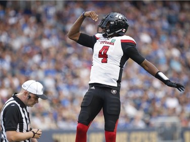 Redblacks quarterback Dominique Davis marks a touchdown run against the Bombers in the first half.