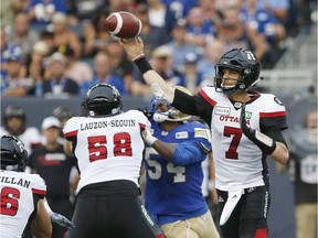 Redblacks quarterback Trevor Harris throws a pass during the first half of  the August 17 game against the Blue Bombers.
