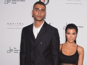 Younes Bendjima, left, and Kourtney Kardashian arrive for The Syrian American Medical Society hosts the Voices in Displacement Gala at Riviera 31 at Sofitel on May 4, 2018 in Los Angeles, Calif. (Gabriel Olsen/Getty Images)