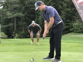 Chad Keohane putts while his dad, Tim, looks on. They just missed the cut in the Ottawa Sun Scramble's GolfTEC B Division on  Wednesday, Aug. 22, 2018 at Le Sorcier. It was another in a series of close calls for the father-son duo.