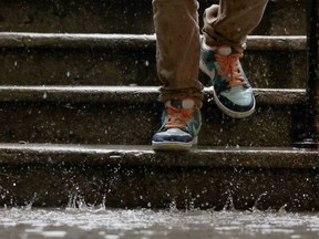 Water splashes on some sneakers.
