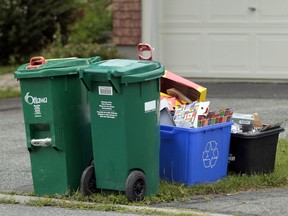 A Ottawa green bins waiting for pickup.