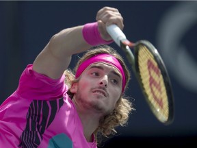 Stefanos Tsitsipas serves to Kevin Anderson during Rogers Cup singles semifinal action in Toronto on Saturday.