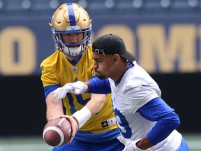 Quarterback Matt Nichols hands off to running back Andrew Harris during a Winnipeg Blue Bombers practice this week. Nichols leads the CFL's top offence while Harris leads the league in rushing.