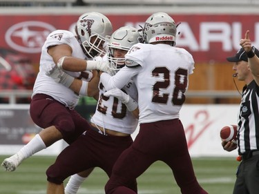 The University of Ottawa Gee-Gees' Luke Griese (20) celebrates after catching the ball during first-half action.