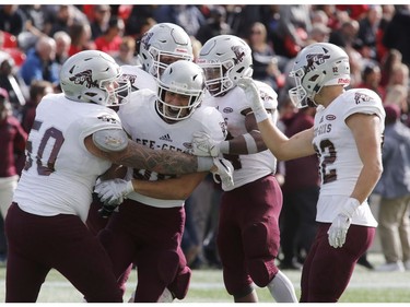 The University of Ottawa Gee-Gees' Dylan St. Pierre (88) celebrates catching a touchdown pass with teammates during the Panda Game at TD Place on Saturday, Sept. 28, 2018. Patrick Doyle, Postmedia