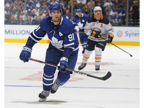 John Tavares #91 of the Toronto Maple Leafs watches a high puck against the Buffalo Sabres during an NHL pre-season game at Scotiabank Arena on September 21, 2018 in Toronto, Ontario, Canada.