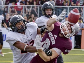 Nate Hamlin breaks up a passing play while a member of the Carleton Ravens.