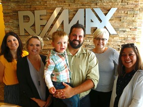 Luis Biggs with his son Ollie and (L-R) Chantale Nephin, Brianne Luckasavitch, Liz Powell, and Erin Lee. Luis and his RE/MAX Affiliates Reality (Chantale and Liz) do charitable work including a fundraiser run for Lanark County Interval House (Brianne and Erin). September 26,2018. Errol McGihon/Postmedia