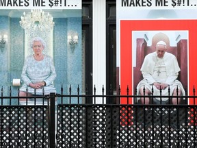 Signs on a residential building across from the Shepherds of Good Hope on Murray Street. Julie Oliver/Postmedia