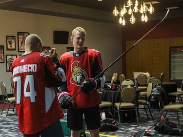 Ottawa Senators Mark Borowiecki and Brady Tkachuk prepare to have their official photos taken at the Canadian Tire Centre on the first day of training camp. September 13, 2018.