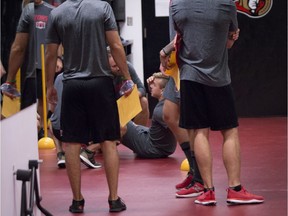 Ottawa Senators J.G. Pageau sits on the ground after getting injured performing a fitness test at the Canadian Tire Centre on the first day of training camp. September 13, 2018.