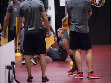 Ottawa Senators J.G. Pageau sits on the ground after getting injured performing a fitness test at the Canadian Tire Centre on the first day of training camp. September 13, 2018.