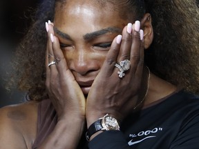 Serena Williams reacts during the trophy ceremony in the women's final of the U.S. Open tennis tournament, Saturday, Sept. 8, 2018, in New York. Naomi Osaka, of Japan, defeated Williams. (AP Photo/Adam Hunger)